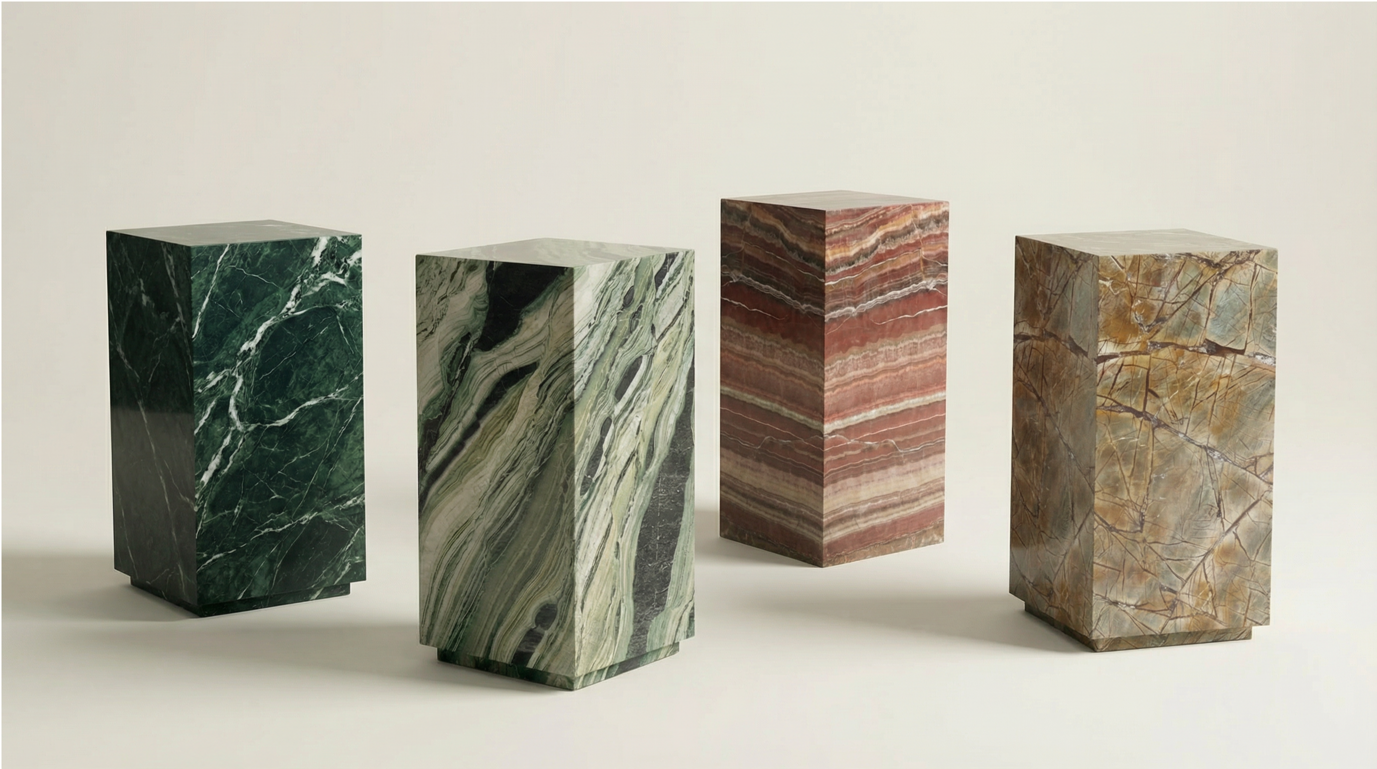 PLNTH Edition — three singular stone forms in red travertine, Carrara white and green marble